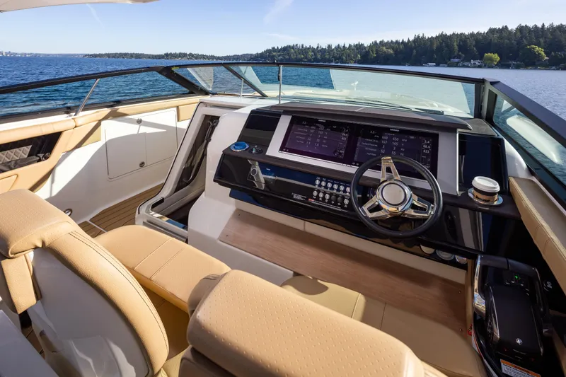 Slide: The Image of Luxurious 2025 Sea Ray SLX 400 yacht cockpit with modern controls and scenic lake view. - 22