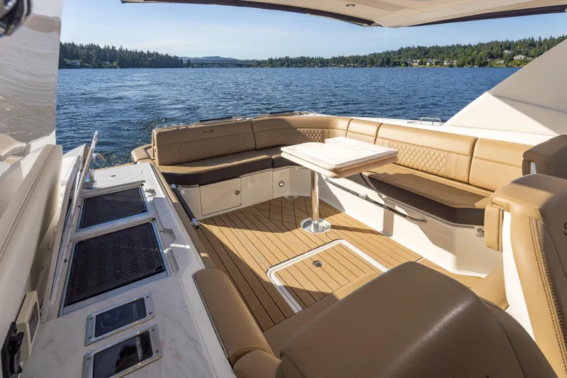 Slide: The Image of Luxurious 2025 Sea Ray SLX 400 yacht interior with elegant seating and scenic water view. - 24