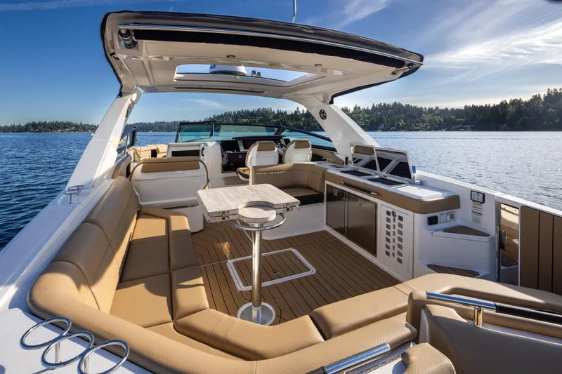 Slide: The Image of Luxurious 2025 Sea Ray SLX 400 yacht interior with spacious seating and scenic lake view. - 26
