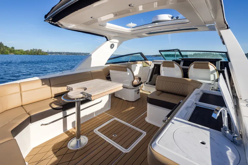 Slide: The Image of Luxurious 2025 Sea Ray SLX 400 yacht interior with elegant seating and modern amenities on open water. - 28