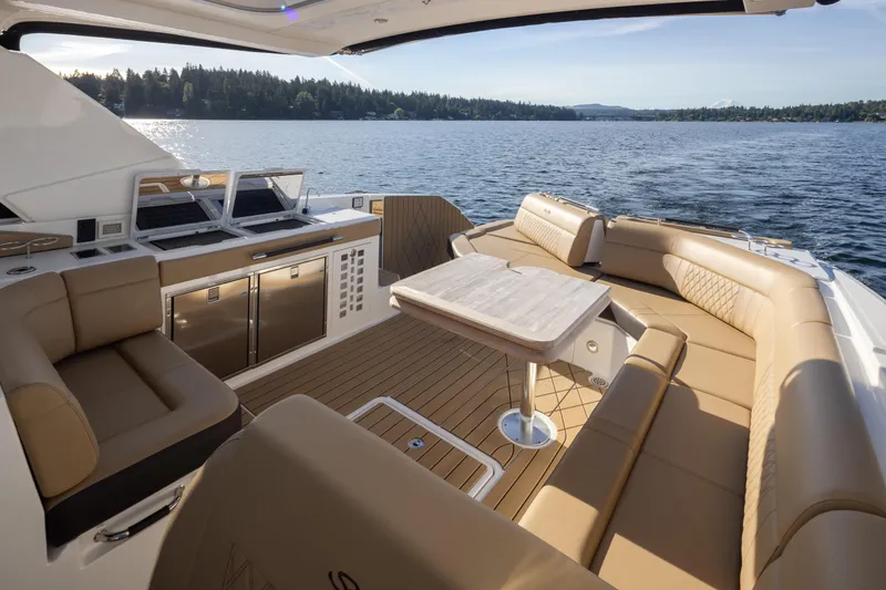 Slide: The Image of Luxurious 2025 Sea Ray SLX 400 yacht interior with elegant seating and scenic lake view. - 31