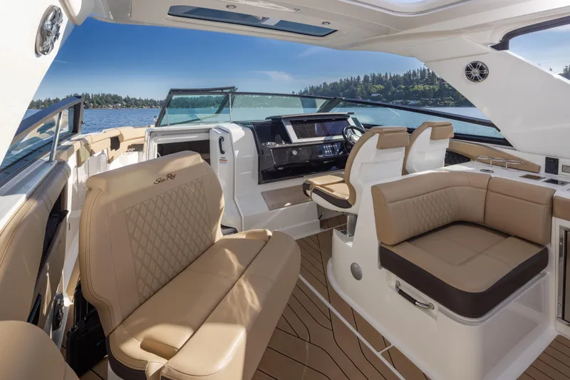 Slide: The Image of Luxurious interior of 2025 Sea Ray SLX 400 yacht with elegant seating and modern dashboard. - 33