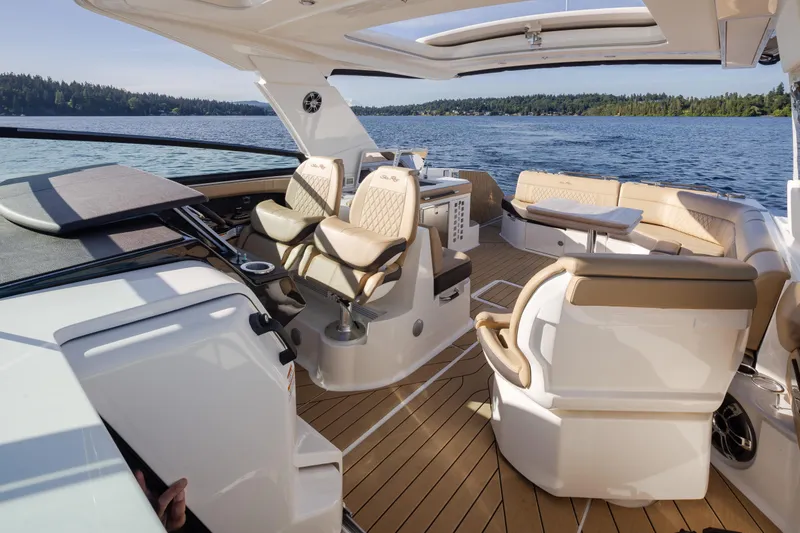 Slide: The Image of Luxurious 2025 Sea Ray SLX 400 yacht interior with elegant seating and scenic water view. - 35