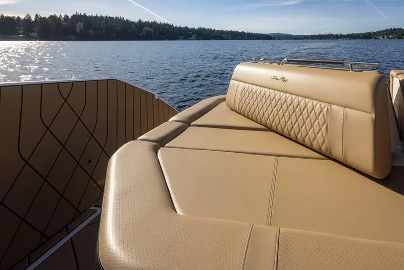 Slide: The Image of Luxurious seating on 2025 Sea Ray SLX 400 boat, overlooking serene lake waters. - 38