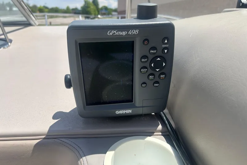 Slide: The Image of Garmin GPSmap 498 on 1998 Four Winns 258 Vista boat dashboard. - 12