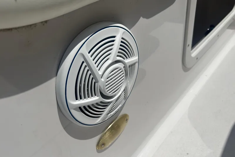 Slide: The Image of White speaker on 1998 Four Winns 258 Vista boat exterior. - 13