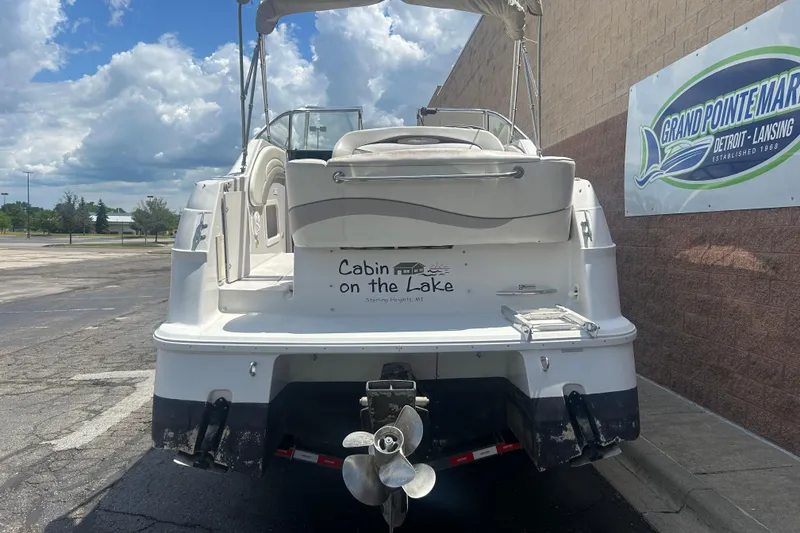 Slide: The Image of 1998 Four Winns 258 Vista boat parked near Grand Pointe Marina sign. - 3