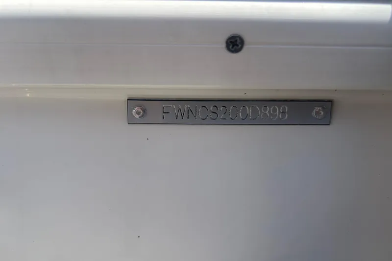 Slide: The Image of 1998 Four Winns 258 Vista boat identification plate with serial number. - 7