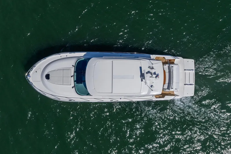 Slide: The Image of Aerial view of 2020 Tiara Yachts C53 Coupe cruising on open water. - 20