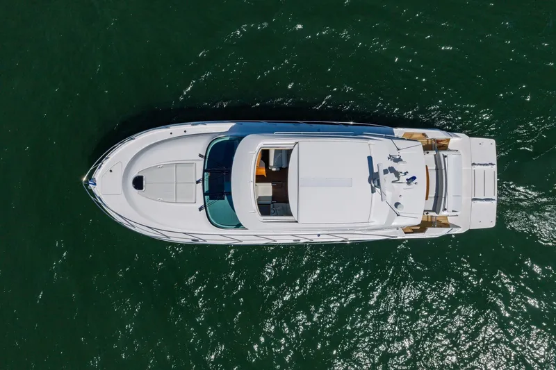 Slide: The Image of Aerial view of 2020 Tiara Yachts C53 Coupe on open water. - 21