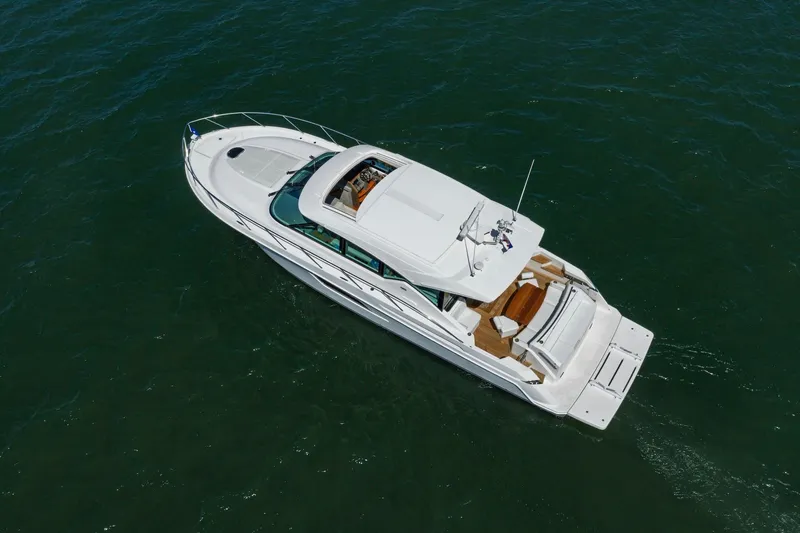Slide: The Image of Aerial view of 2020 Tiara Yachts C53 Coupe cruising on open water. - 26