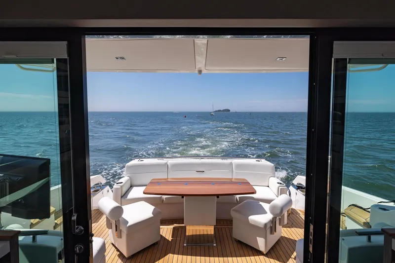 Slide: The Image of 2020 Tiara Yachts C53 Coupe, luxurious deck view over open sea. - 32