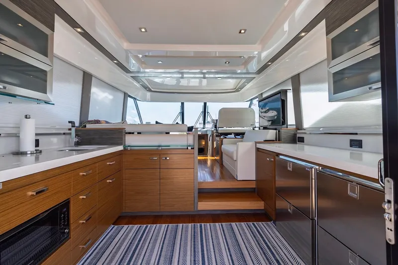 Slide: The Image of Luxurious interior of 2020 Tiara Yachts C53 Coupe, featuring modern kitchen and sleek design. - 34