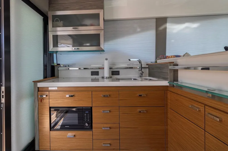 Slide: The Image of Modern kitchen interior of 2020 Tiara Yachts C53 Coupe with sleek cabinetry and appliances. - 35