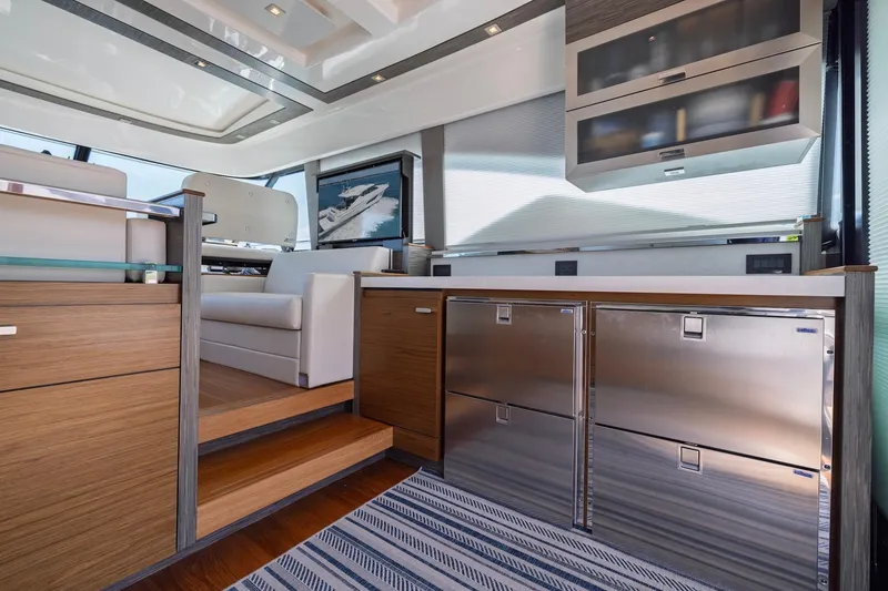 Slide: The Image of Luxurious interior of 2020 Tiara Yachts C53 Coupe with modern cabinetry and seating. - 37