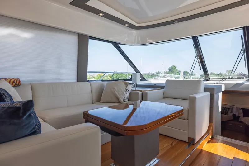 Slide: The Image of Luxurious interior of 2020 Tiara Yachts C53 Coupe with elegant seating and panoramic windows. - 44