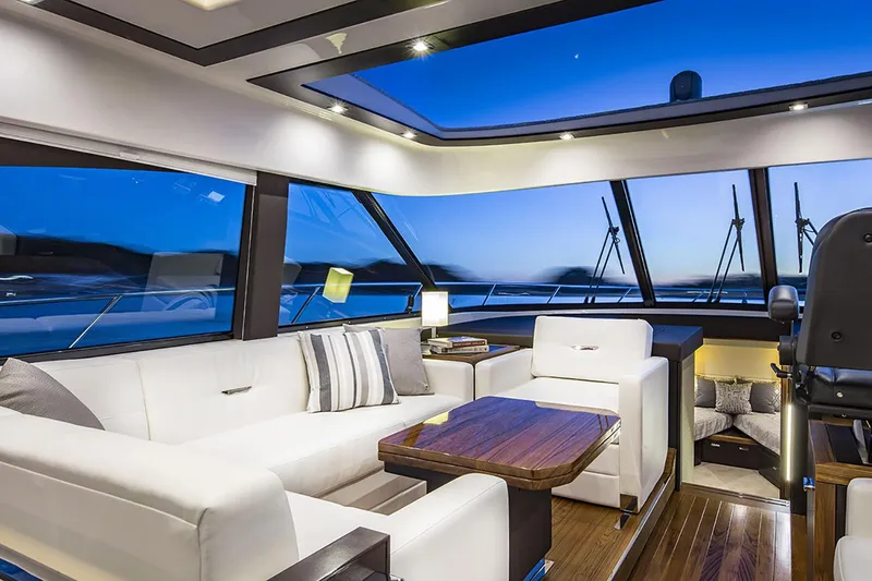 Slide: The Image of Manufacturer Provided Image: Luxurious interior of 2020 Tiara Yachts C53 Coupe with panoramic windows and modern furnishings. - 47