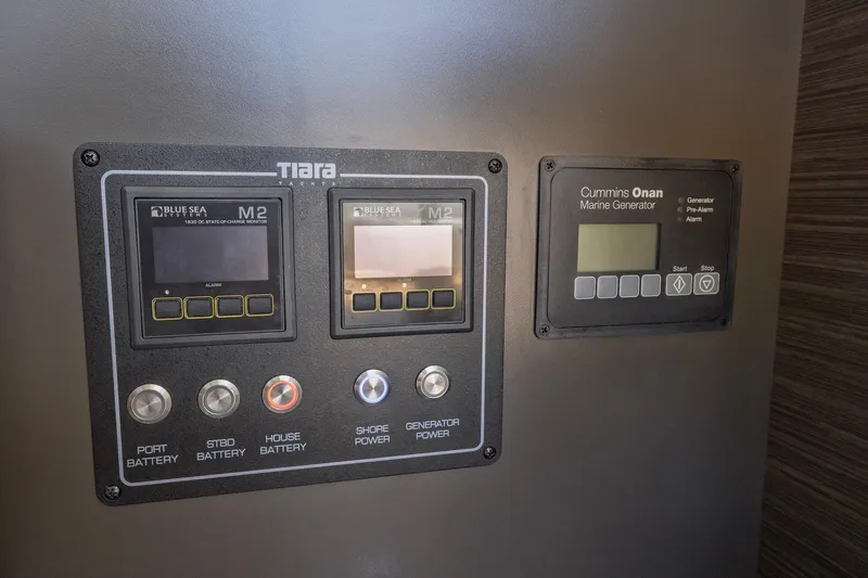 Slide: The Image of Control panel of a 2020 Tiara Yachts C53 Coupe with marine generator display. - 54