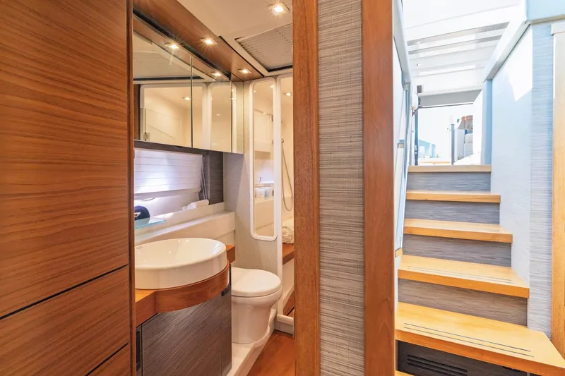 Slide: The Image of Luxurious bathroom interior of 2020 Tiara Yachts C53 Coupe with wooden accents. - 56