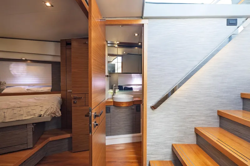 Slide: The Image of Luxurious interior of 2020 Tiara Yachts C53 Coupe, featuring elegant wood finishes and modern design. - 57
