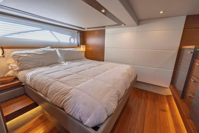 Slide: The Image of Luxurious bedroom interior of 2020 Tiara Yachts C53 Coupe with elegant wood flooring. - 58