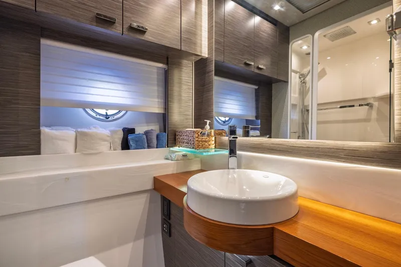 Slide: The Image of Luxurious bathroom interior of 2020 Tiara Yachts C53 Coupe with modern sink and elegant design. - 65