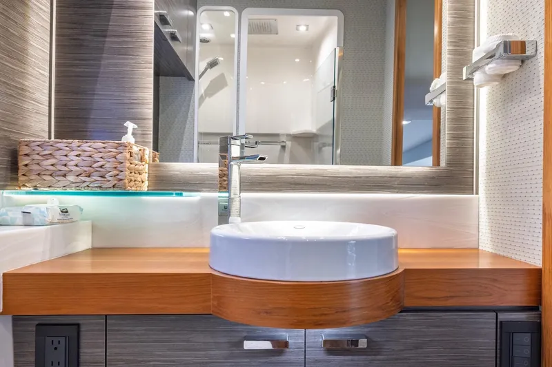 Slide: The Image of Luxurious bathroom interior of 2020 Tiara Yachts C53 Coupe with modern sink and elegant design. - 70