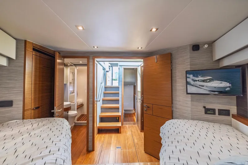 Slide: The Image of Luxurious interior of 2020 Tiara Yachts C53 Coupe with modern design and wooden finishes. - 73