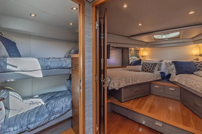 Slide: The Image of Luxurious 2020 Tiara Yachts C53 Coupe interior with cozy bunk beds and elegant master suite. - 74