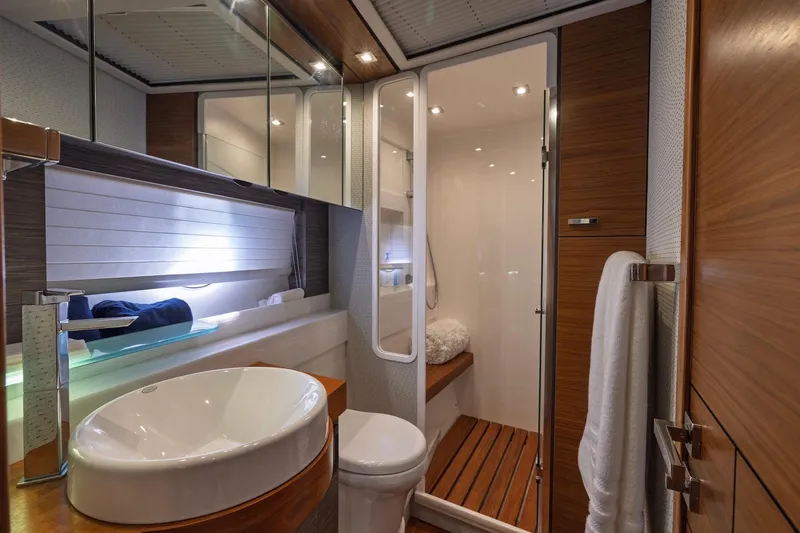 Slide: The Image of Luxurious bathroom interior of 2020 Tiara Yachts C53 Coupe with modern fixtures and wooden accents. - 75
