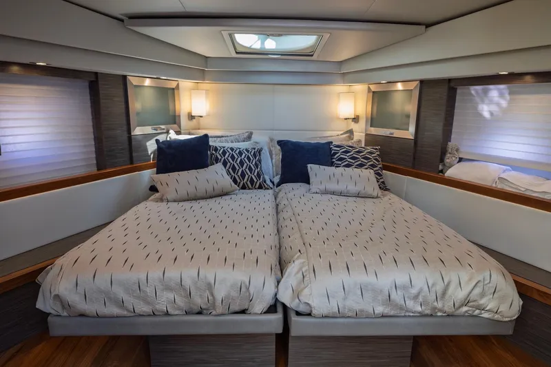 Slide: The Image of Luxurious bedroom interior of 2020 Tiara Yachts C53 Coupe with twin beds and elegant decor. - 77