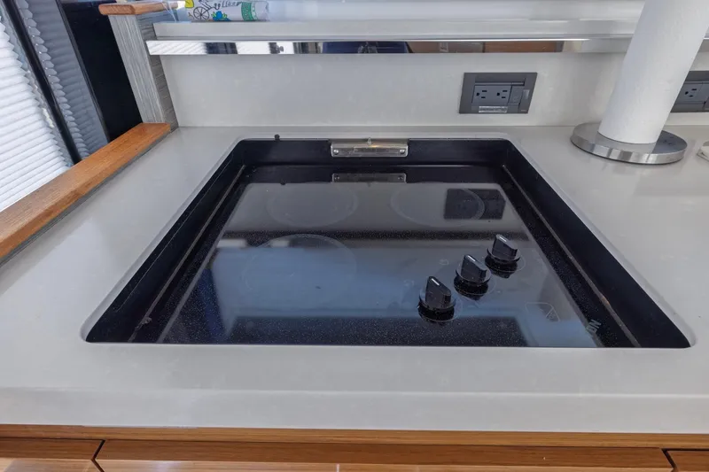 Slide: The Image of Modern stovetop in 2020 Tiara Yachts C53 Coupe kitchen area. - 83