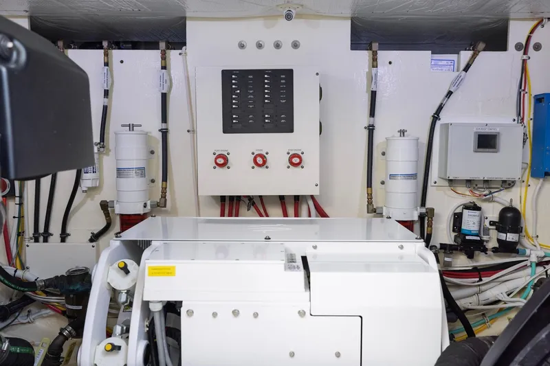 Slide: The Image of Engine room of 2020 Tiara Yachts C53 Coupe with control panels and wiring. - 85