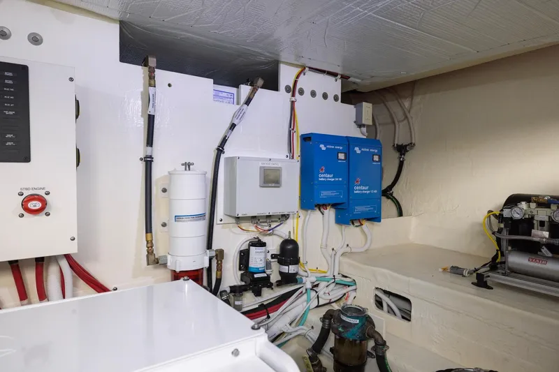 Slide: The Image of Engine room of 2020 Tiara Yachts C53 Coupe with electrical and mechanical systems. - 86