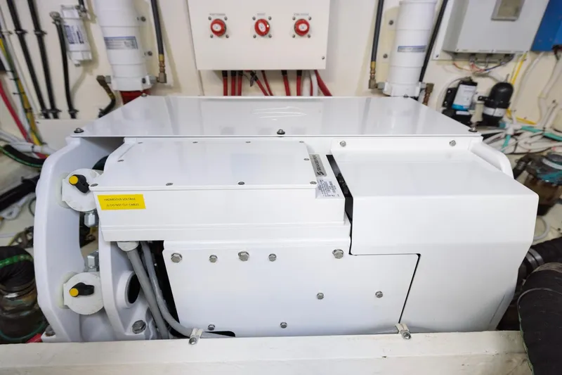 Slide: The Image of Engine room of 2020 Tiara Yachts C53 Coupe, showcasing machinery and wiring. - 88