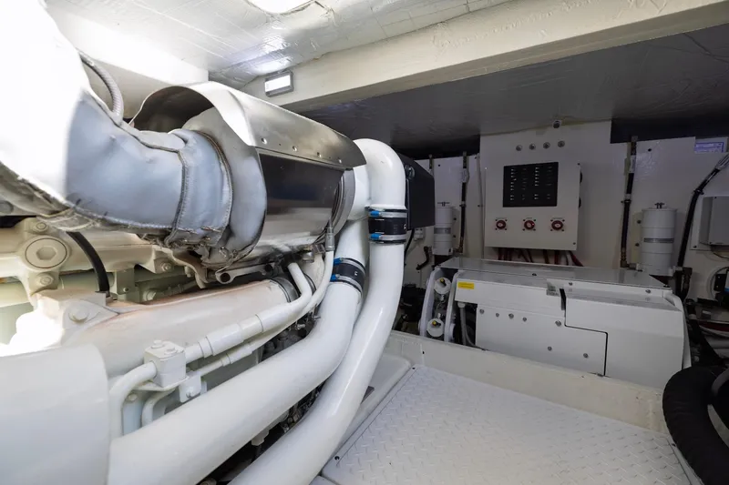 Slide: The Image of Engine room of 2020 Tiara Yachts C53 Coupe, showcasing mechanical components and systems. - 91