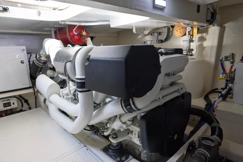 Slide: The Image of Engine room of 2020 Tiara Yachts C53 Coupe, showcasing advanced marine engineering. - 92
