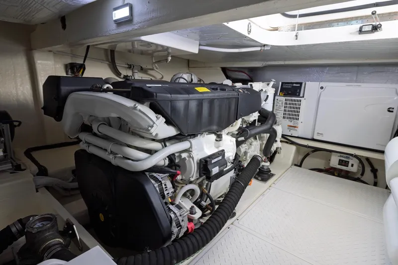 Slide: The Image of Engine room of 2020 Tiara Yachts C53 Coupe, featuring advanced marine engine components. - 93