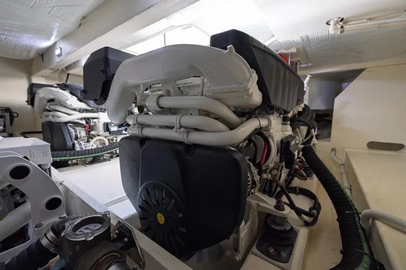 Slide: The Image of Engine room of 2020 Tiara Yachts C53 Coupe, showcasing advanced marine machinery. - 95