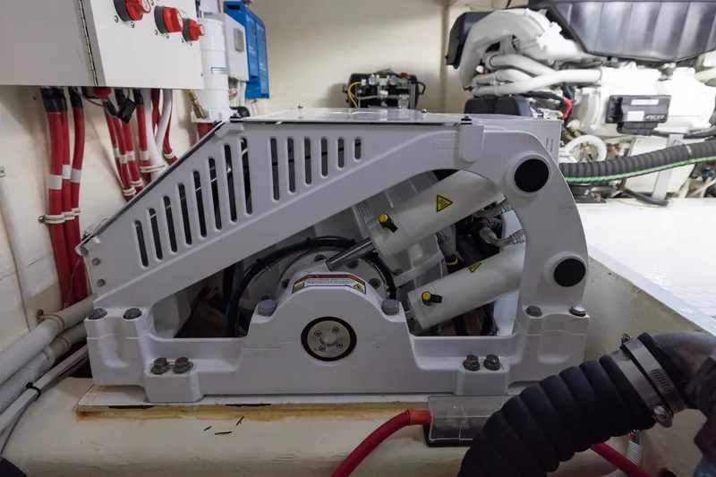 Slide: The Image of Engine room of 2020 Tiara Yachts C53 Coupe, showcasing mechanical components and wiring. - 96