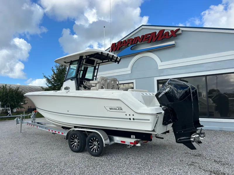 Slide: The Image of A 2027 Boston Whaler 250 Outrage on a trailer in front of a MarineMax building. - 4