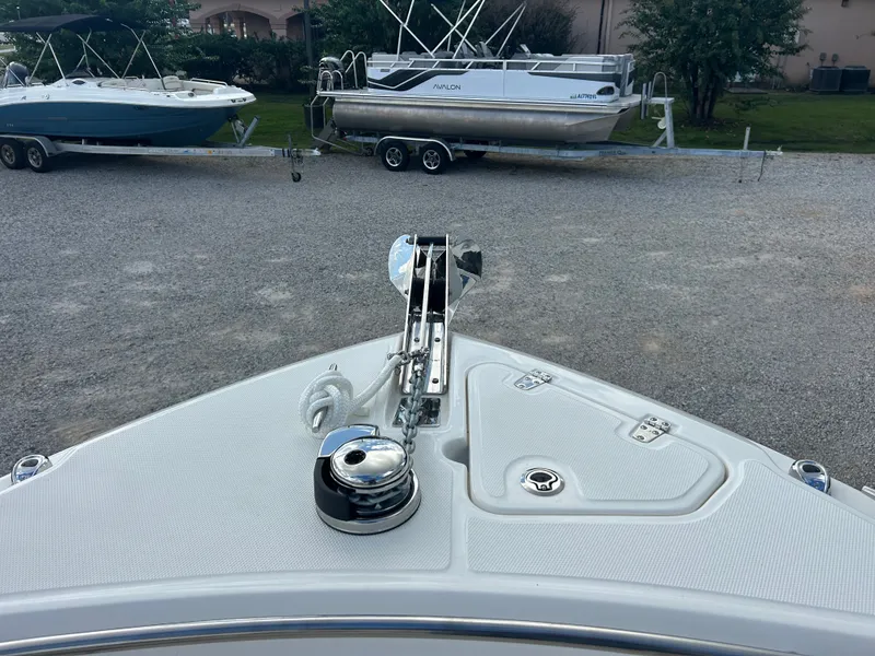 Slide: The Image of The bow view of a 2027 Boston Whaler 250 Outrage features an anchor windlass and rope. - 25