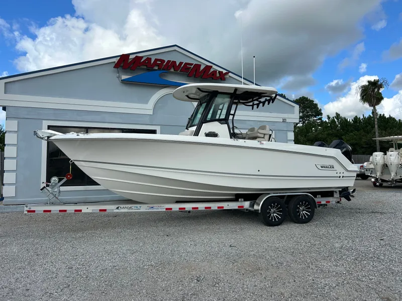 Slide: The Image of A 2027 Boston Whaler 250 Outrage on a trailer in front of a MarineMax building. - 5