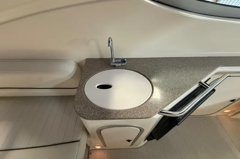 Slide: The Image of 2005 Maxum 3300 SCR boat interior with sink and countertop. - 11