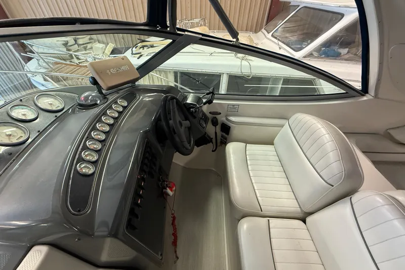 Slide: The Image of 2005 Maxum 3300 SCR boat cockpit with steering wheel and instrument panel. - 17