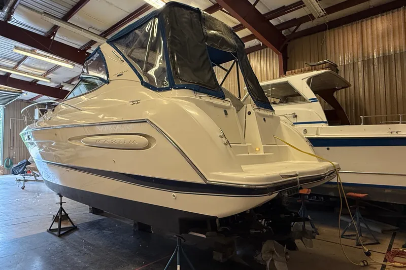 Slide: The Image of 2005 Maxum 3300 SCR boat in a storage facility, rear view. - 2
