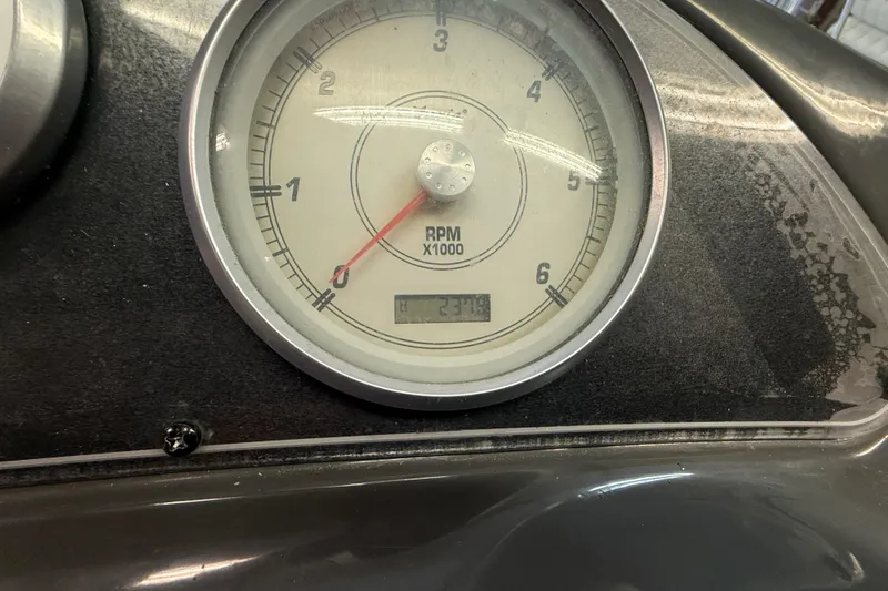 Slide: The Image of Close-up of a 2005 Maxum 3300 SCR tachometer showing RPM and engine hours. - 20