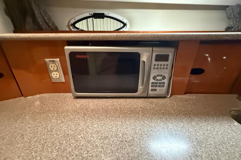 Slide: The Image of Microwave in 2005 Maxum 3300 SCR yacht kitchen with power outlet nearby. - 38