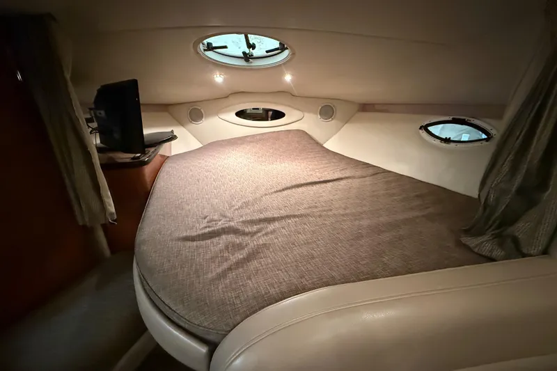 Slide: The Image of Cozy cabin interior of 2005 Maxum 3300 SCR yacht with bed and portholes. - 40