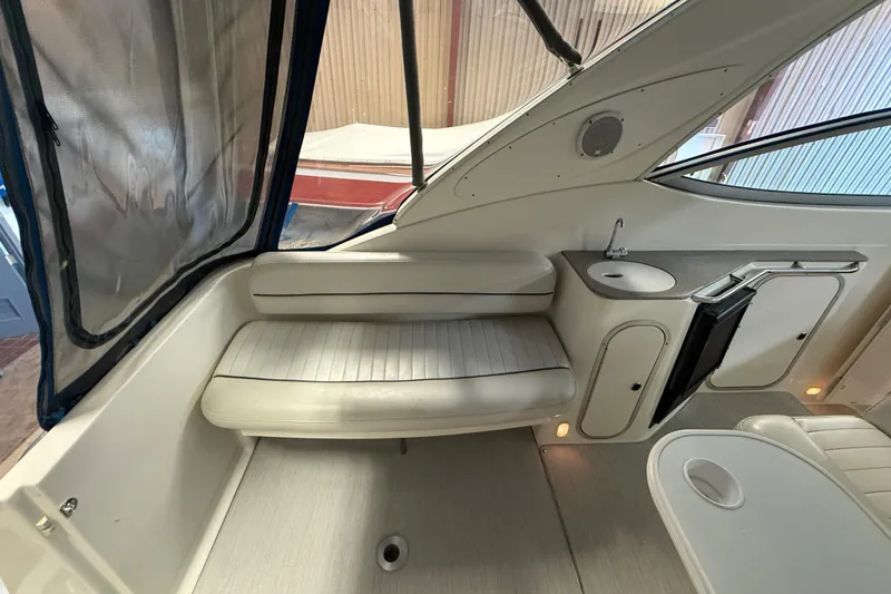 Slide: The Image of Interior of 2005 Maxum 3300 SCR boat with seating and compact kitchenette. - 8